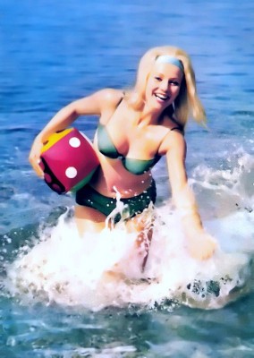 Vintage Bikini style, color and fashion in 1970s. Retro beach costume and hair style in Panton Eames era