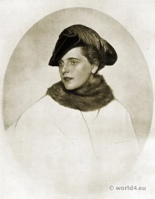 Autumn hat fashion 1915, Berlin. Bicorn hat of dark green velvet with cocks neck feather decoration